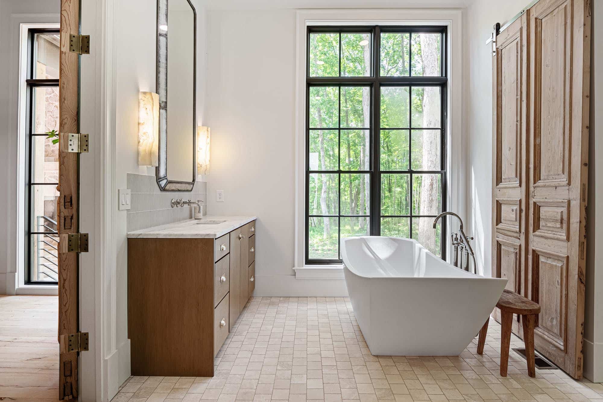 Blackberry Ridge bathroom with white tub and tan tile floor