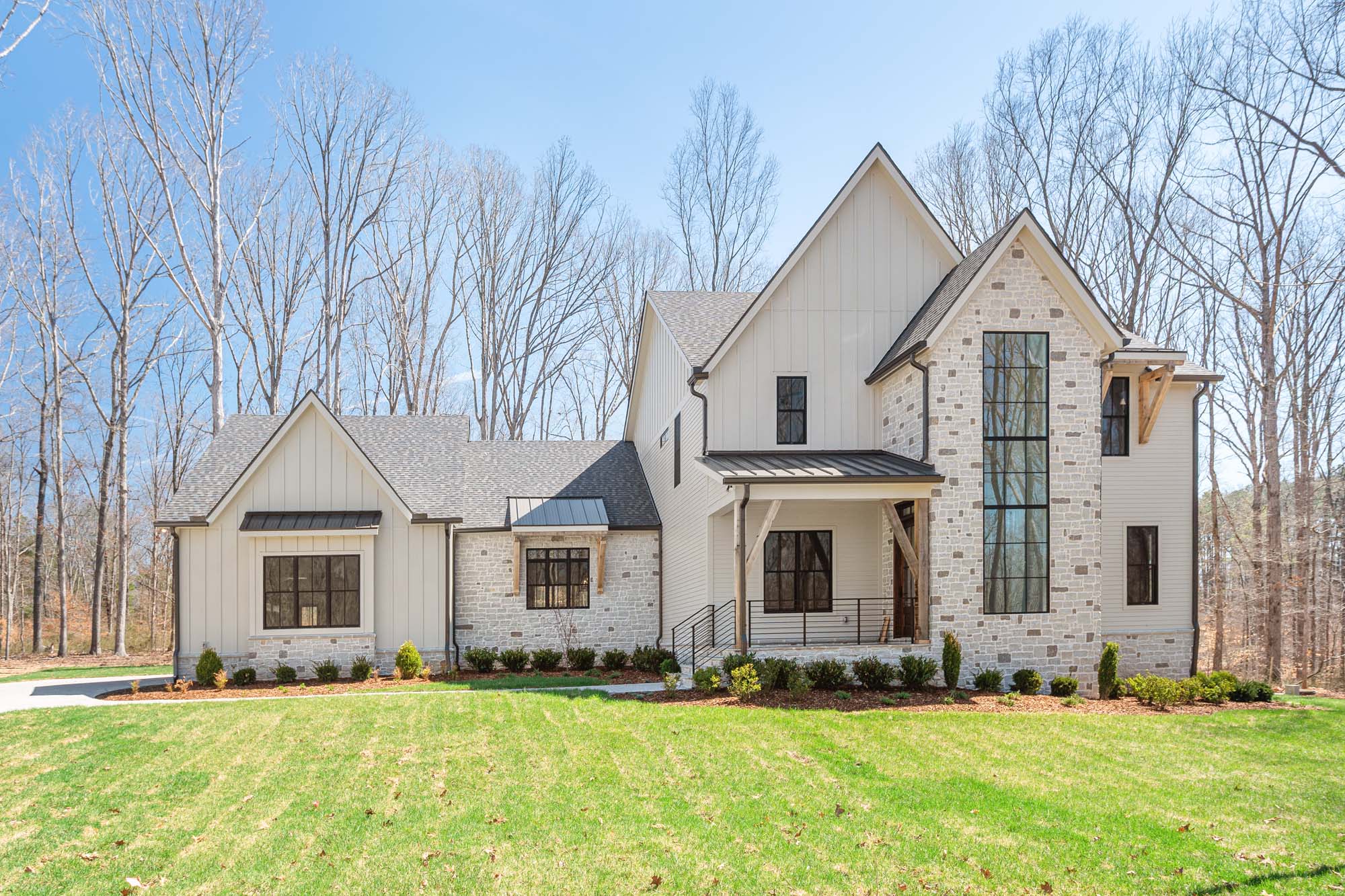 Blackberry Ridge white home exterior and front lawn