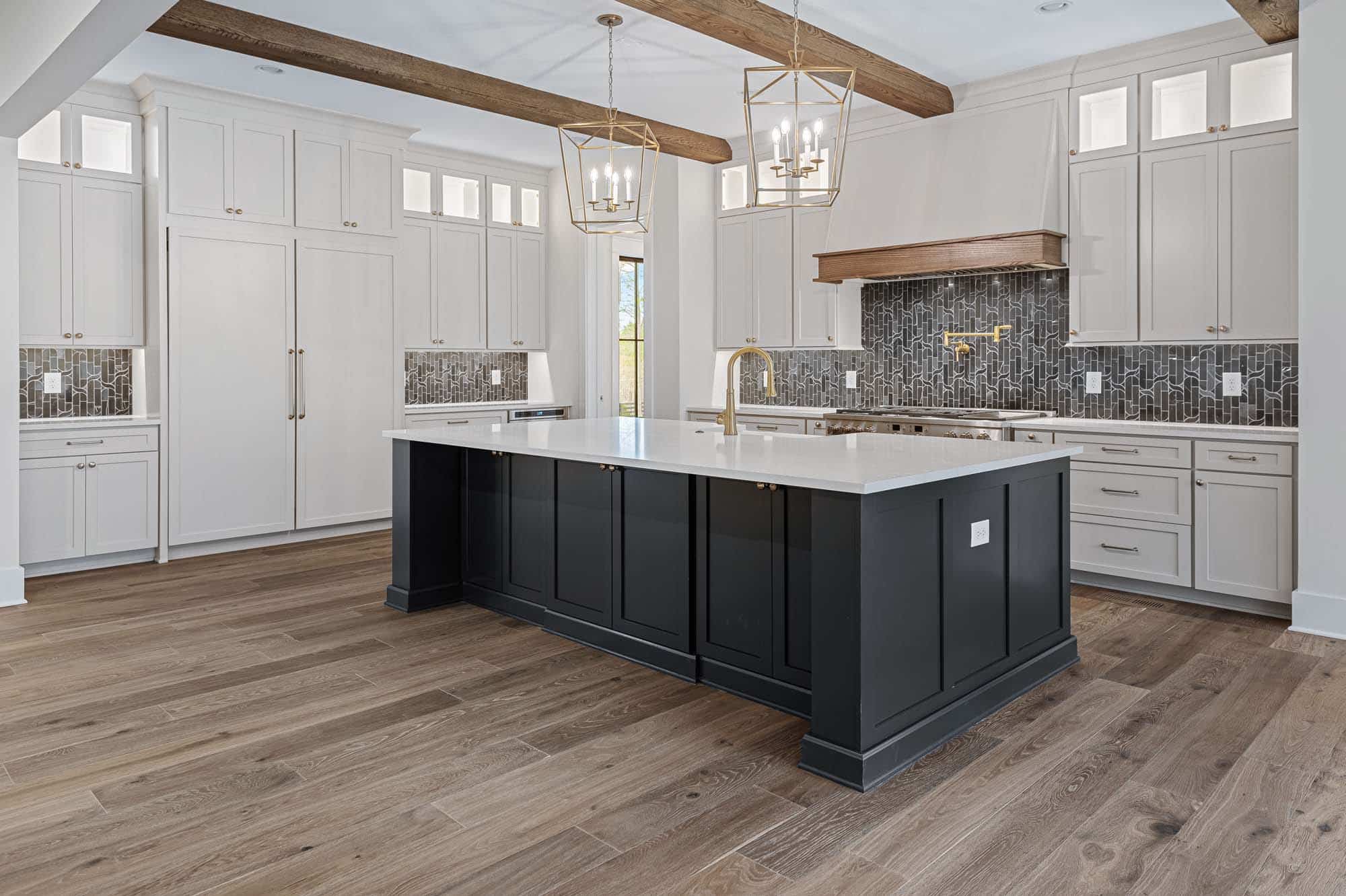 Blackberry Ridge kitchen with white top kitchen island and white walls