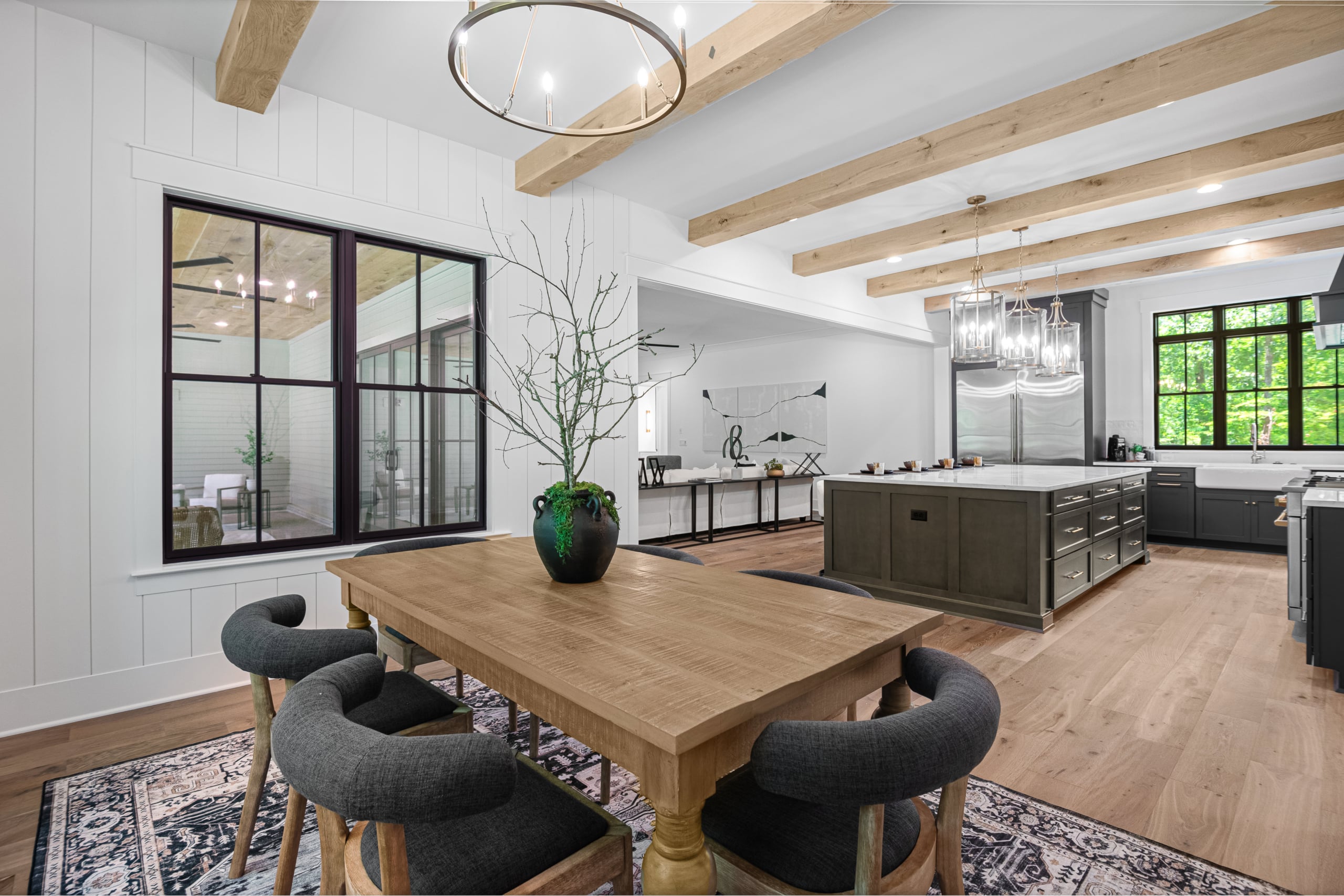A kitchen and dining area with a table and chairs