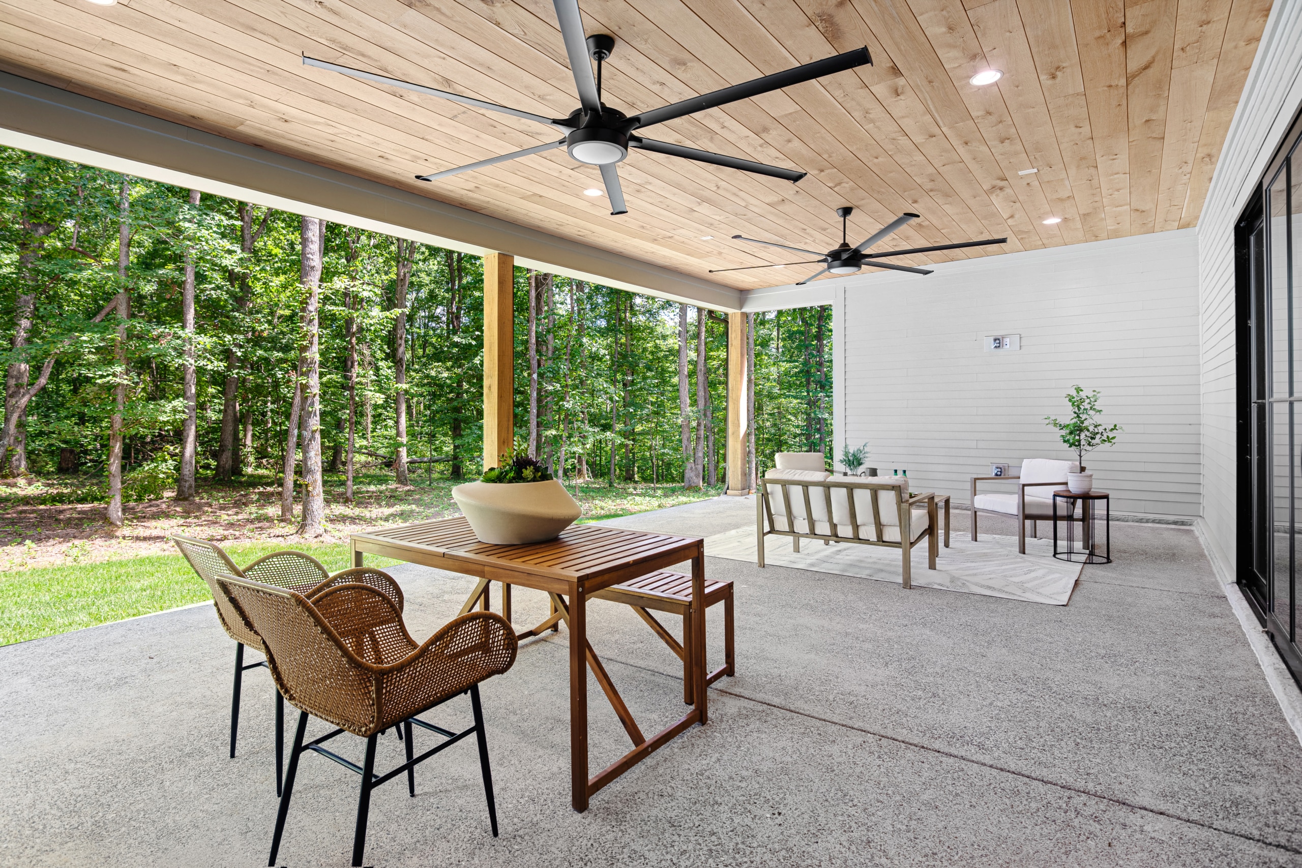Outdoor patio area the looks out into a forest of trees
